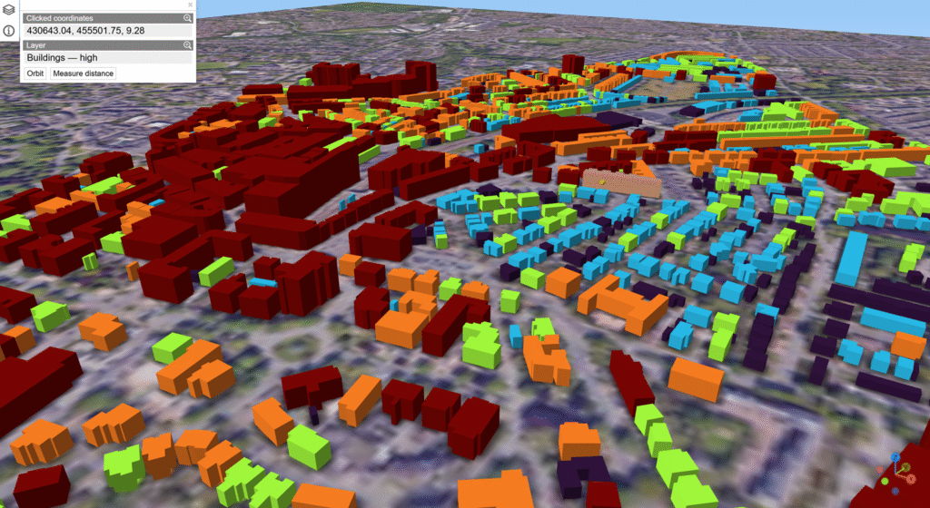 3D city map showing buildings color-coded by height using red, orange, green, blue, and purple blocks over a satellite base map.